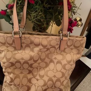 Coach purse. Excellent condition. Light tan and pale pink accents